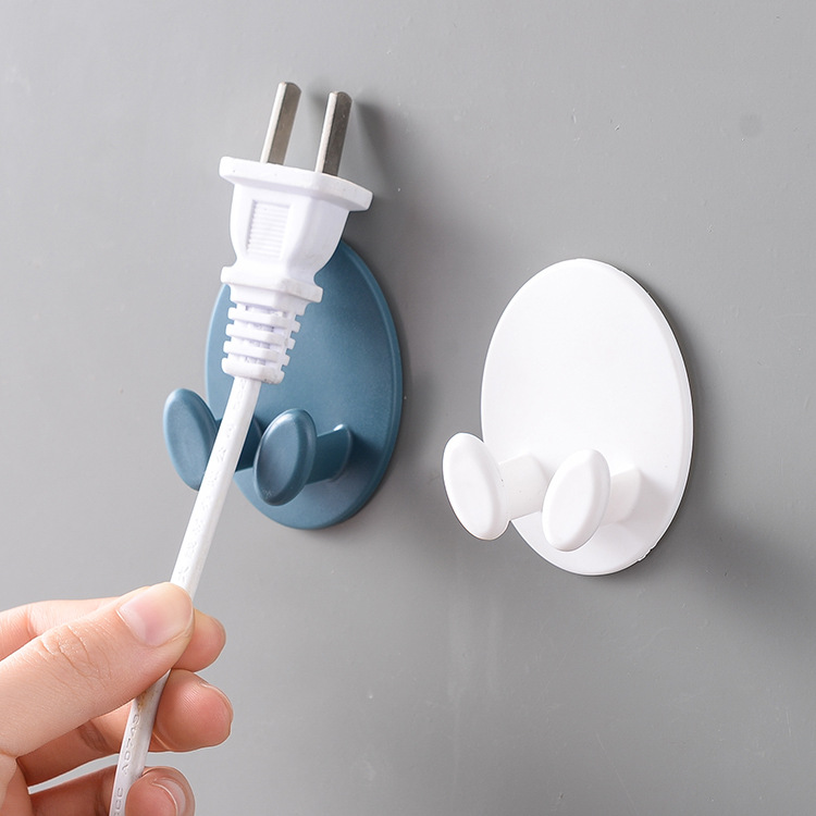 Household no-drill oval plug hook, seamless adhesive wall-mounted power cord organizer